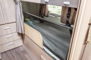 Bunk beds in the caravan. We installed a safety net so our 2 year old would not fall out