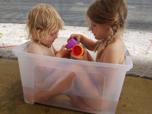 Bathing the kids in a bucket when caravaning with kids