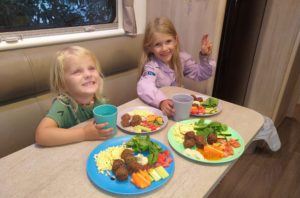 Blonde Nomads eating dinner with their Bamboo plates