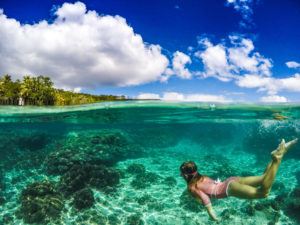Marli from the Blonde Nomads loving mermaid life in New Caledonia 