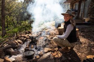 Cooking steaks for lunch over the fire on our travel braai