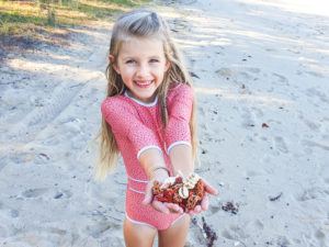 Collecting beach treasures on Pumpkin Island